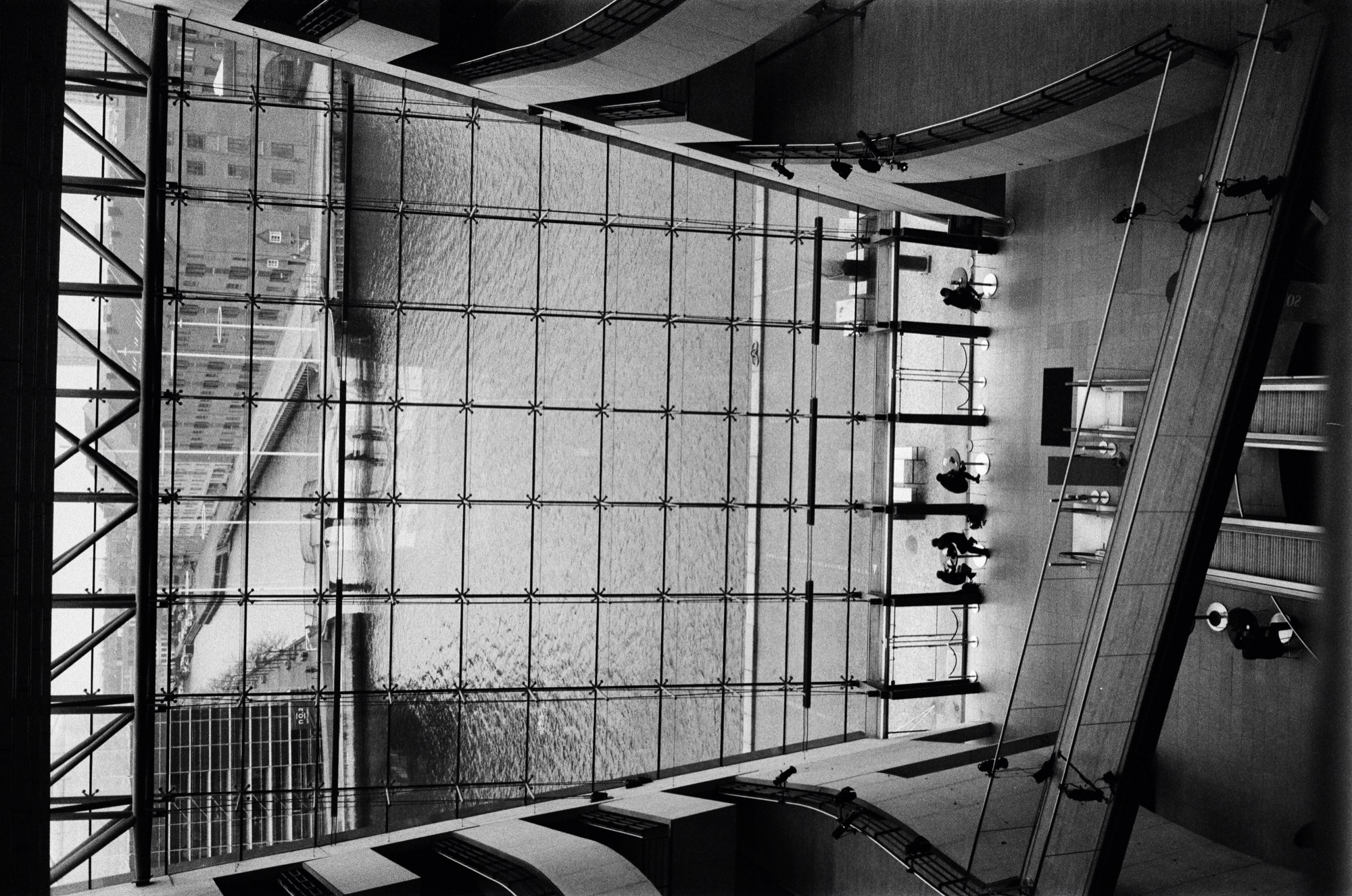 Industrial interior with large grid windows and geometric light